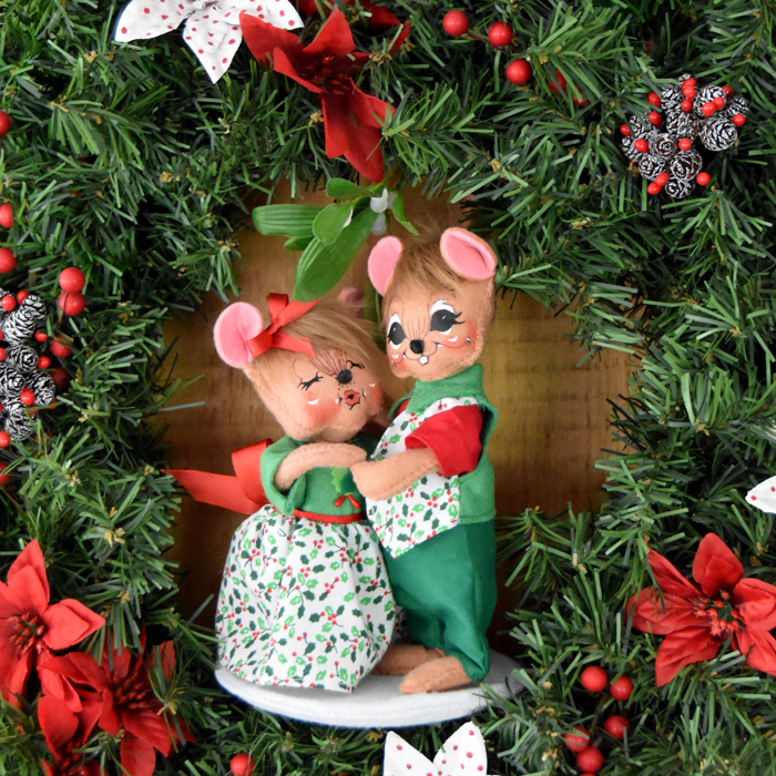 the mistletoe kiss in wreath